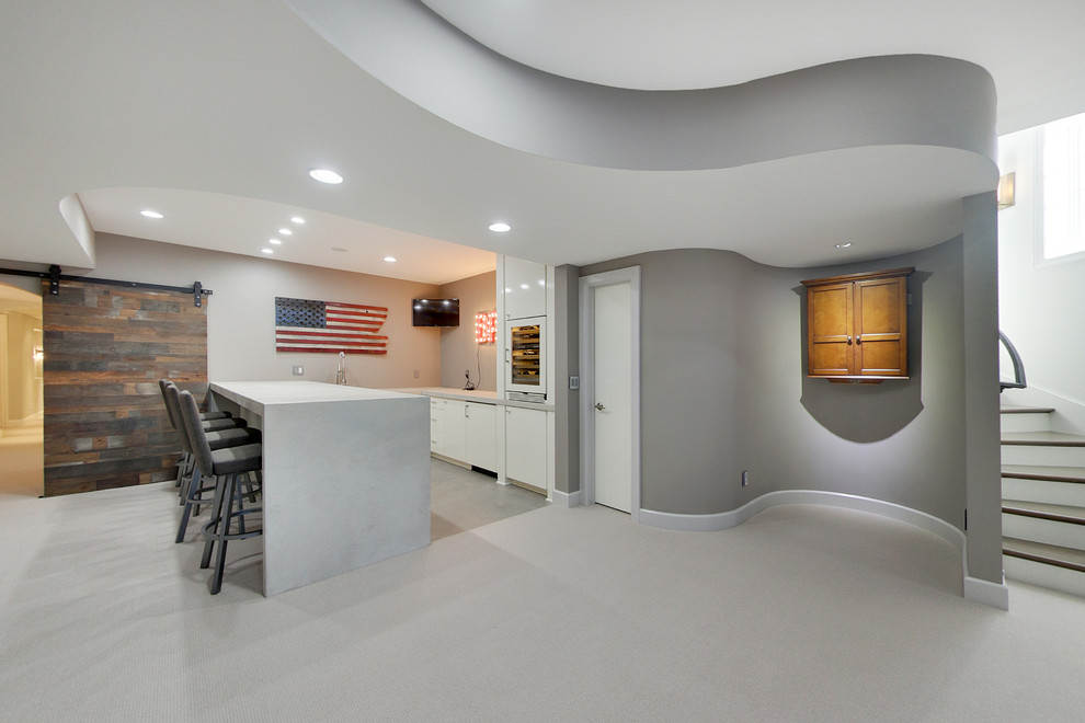 Mid-sized contemporary fully buried basement in Minneapolis with grey walls, carpet and no fireplace.