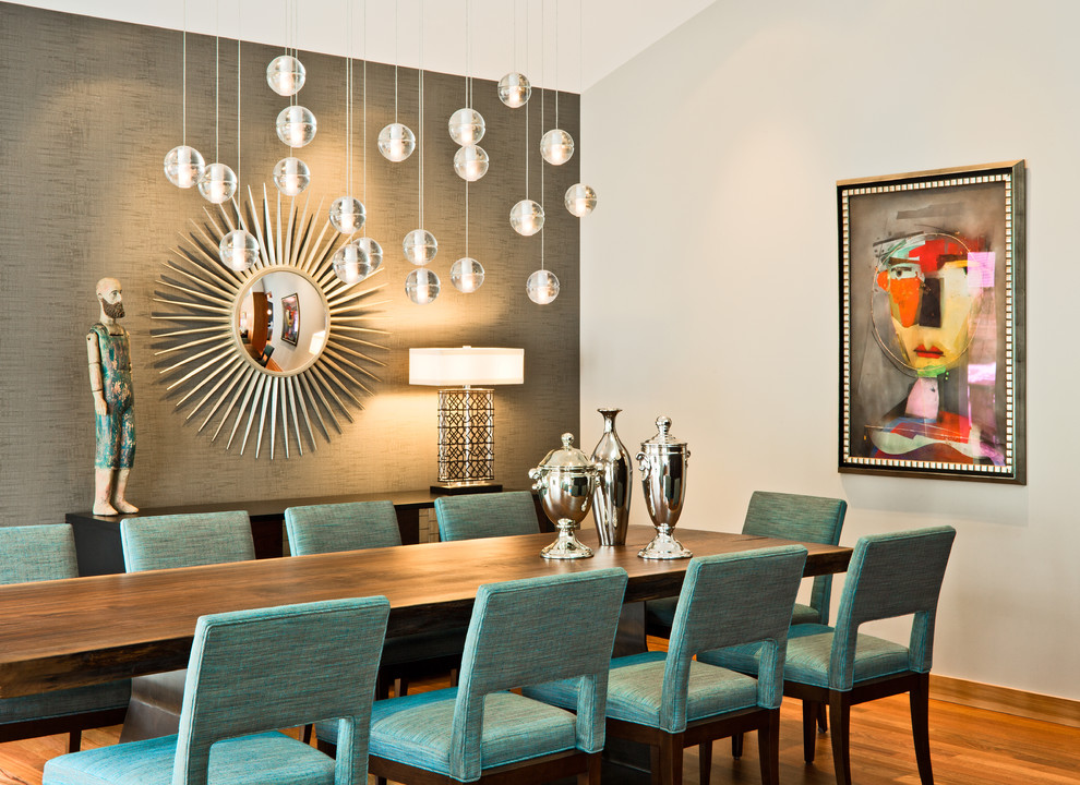 This is an example of a contemporary dining room in Minneapolis with medium hardwood floors and grey walls.