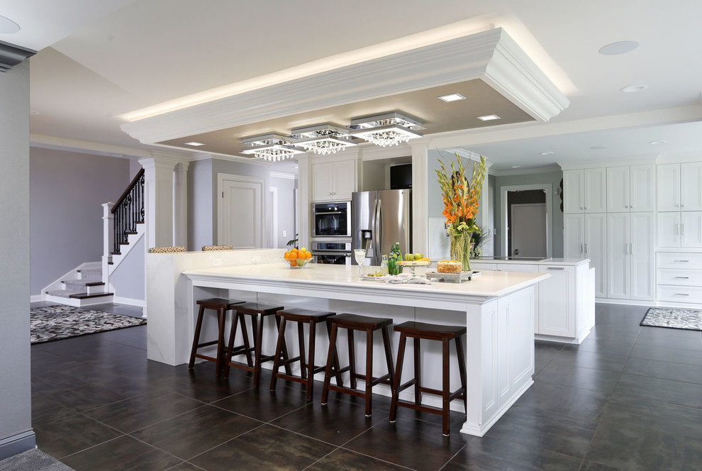 Example of a transitional porcelain tile and gray floor kitchen design in Cedar Rapids with recessed-panel cabinets, white cabinets and glass countertops