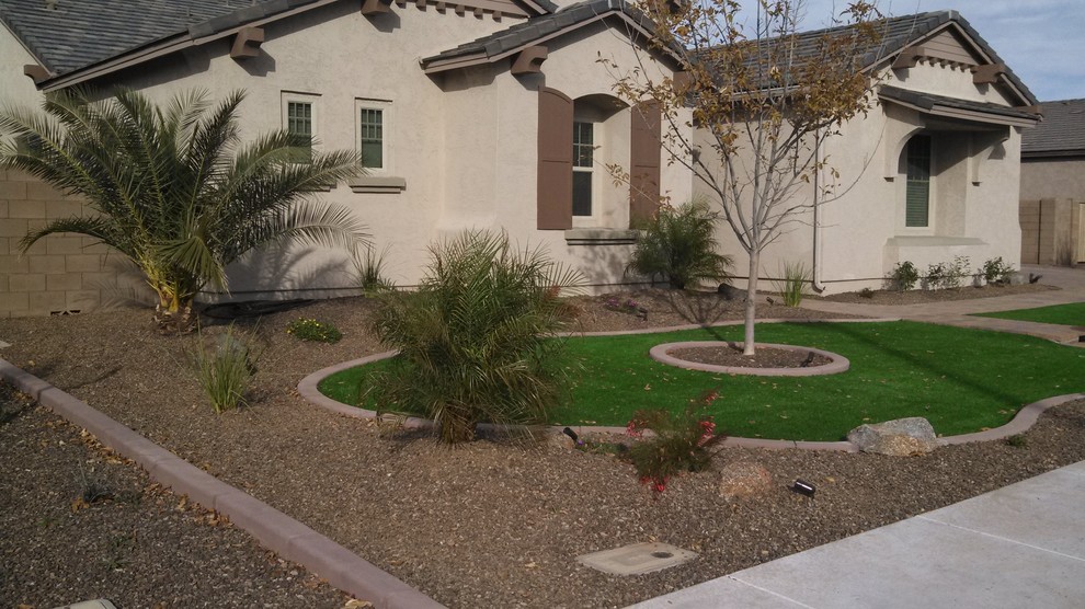 Mid-sized mediterranean front yard full sun garden in Phoenix with a garden path and brick pavers for summer.
