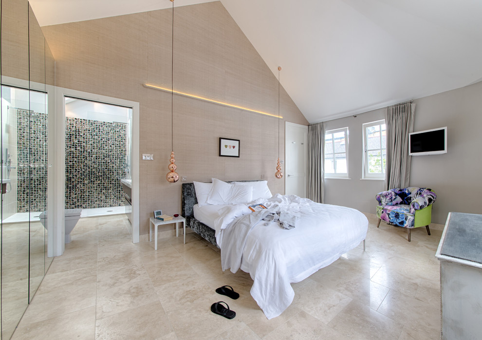 Photo of a contemporary master bedroom in London with beige walls.