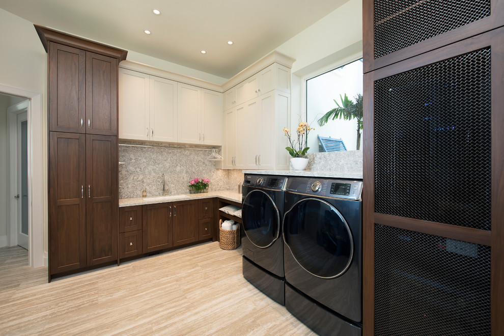Design ideas for a transitional l-shaped laundry room in Miami with shaker cabinets, dark wood cabinets, white benchtop, an undermount sink, white walls, a side-by-side washer and dryer and beige floor.
