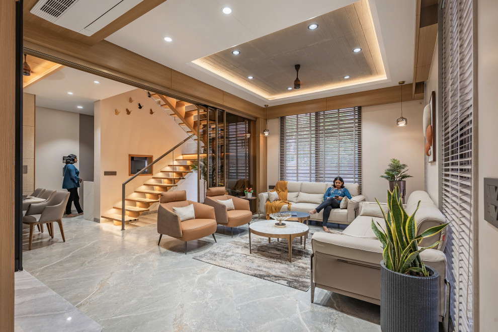 Design ideas for a contemporary living room in Ahmedabad.