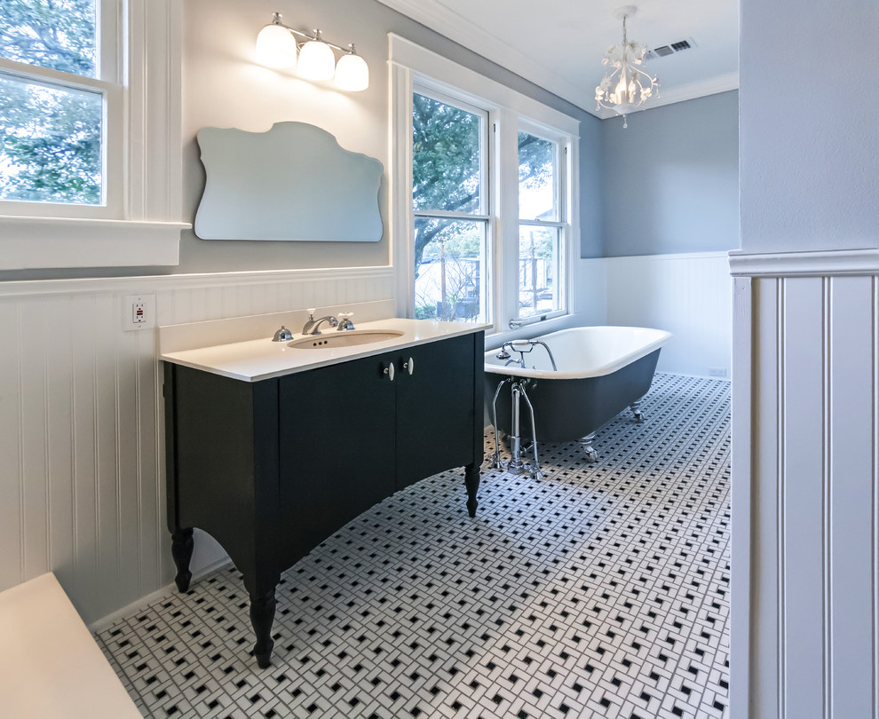 Design ideas for a mid-sized traditional bathroom in Houston with black cabinets, a claw-foot tub, a corner shower, a two-piece toilet, white tile, subway tile, grey walls, ceramic floors, an undermount sink, solid surface benchtops, multi-coloured floor, a hinged shower door and flat-panel cabinets.