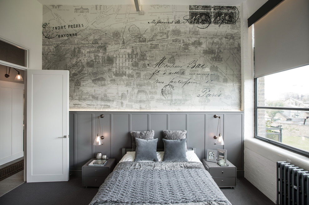 Large industrial master bedroom in London with grey walls and carpet.