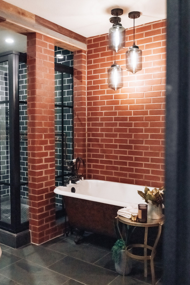 Design ideas for an industrial bathroom in Other with a freestanding tub, a corner shower, green tile, ceramic floors, grey floor, a hinged shower door, brick walls and subway tile.