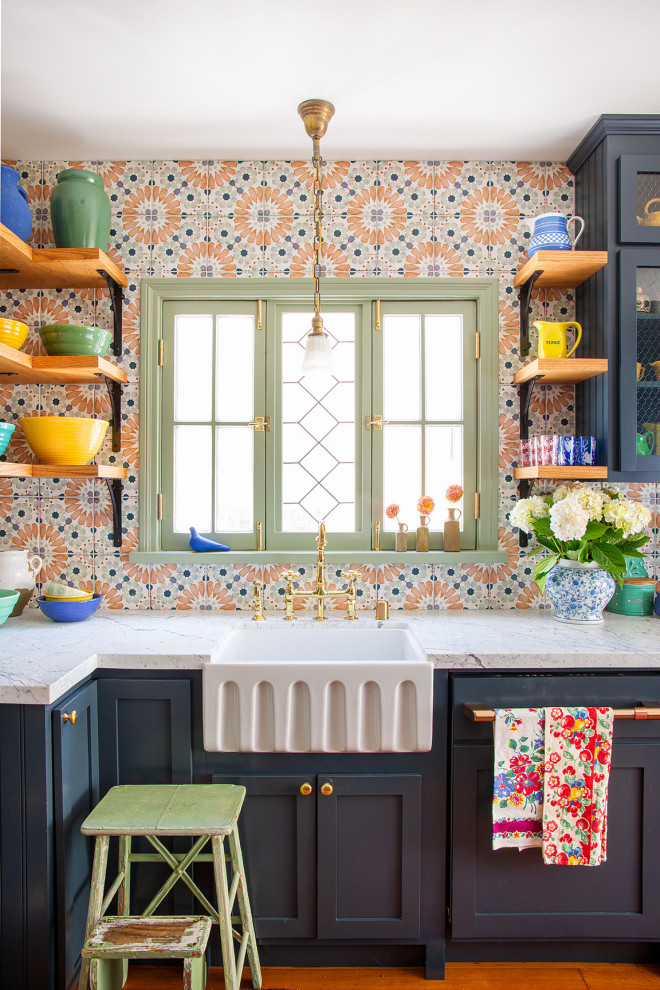 Design ideas for a mid-sized eclectic galley separate kitchen in Los Angeles with a farmhouse sink, shaker cabinets, blue cabinets, marble benchtops, multi-coloured splashback, porcelain splashback, medium hardwood floors and white benchtop.