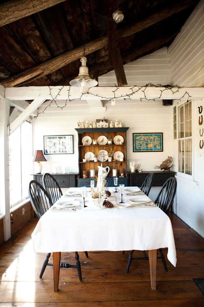 Design ideas for a country dining room in Burlington with white walls and dark hardwood floors.