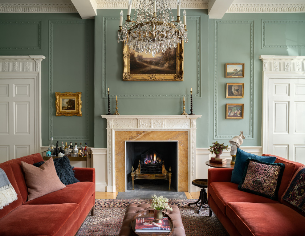 Photo of a large transitional formal enclosed living room in Edinburgh with green walls, a standard fireplace, a tile fireplace surround, no tv and beige floor.