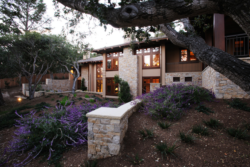 Photo of a mid-sized arts and crafts two-storey brown exterior in San Francisco with stone veneer and a hip roof.