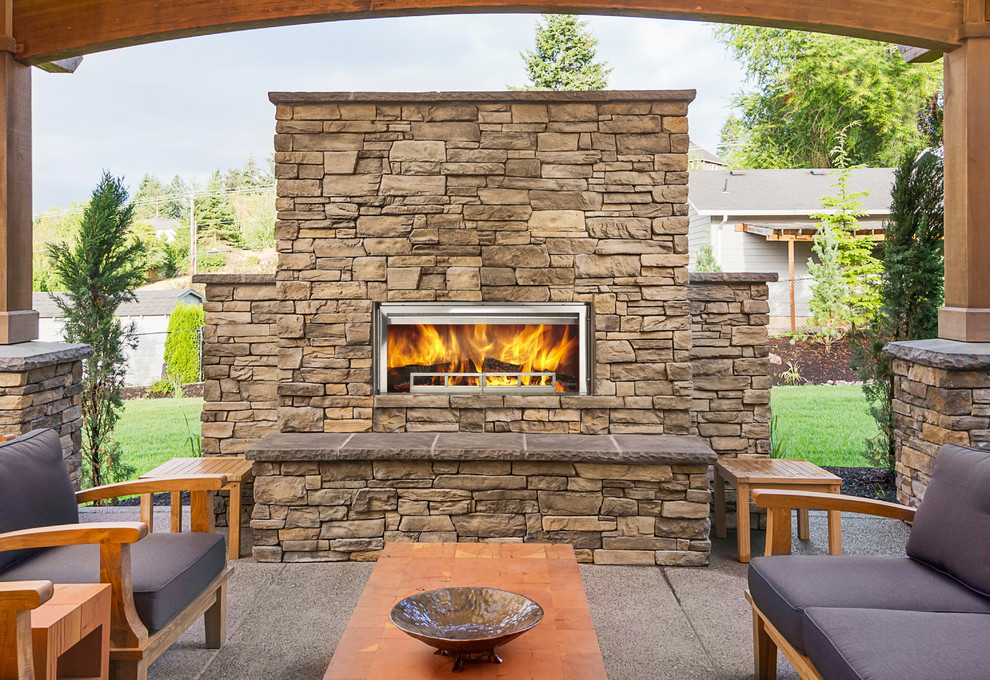 Design ideas for a large country backyard patio in Omaha with a fire feature.