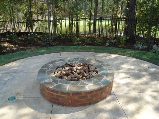Design ideas for a large backyard patio in Atlanta with a fire feature and stamped concrete.