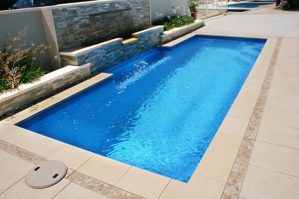 This is an example of a mid-sized contemporary pool in Perth.