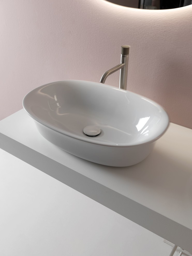 This is an example of a contemporary kids bathroom in London with a vessel sink.