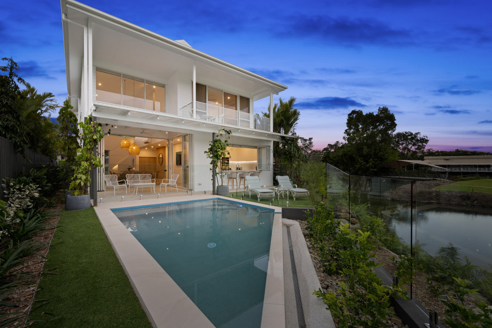 Design ideas for a contemporary two-storey white exterior in Other.