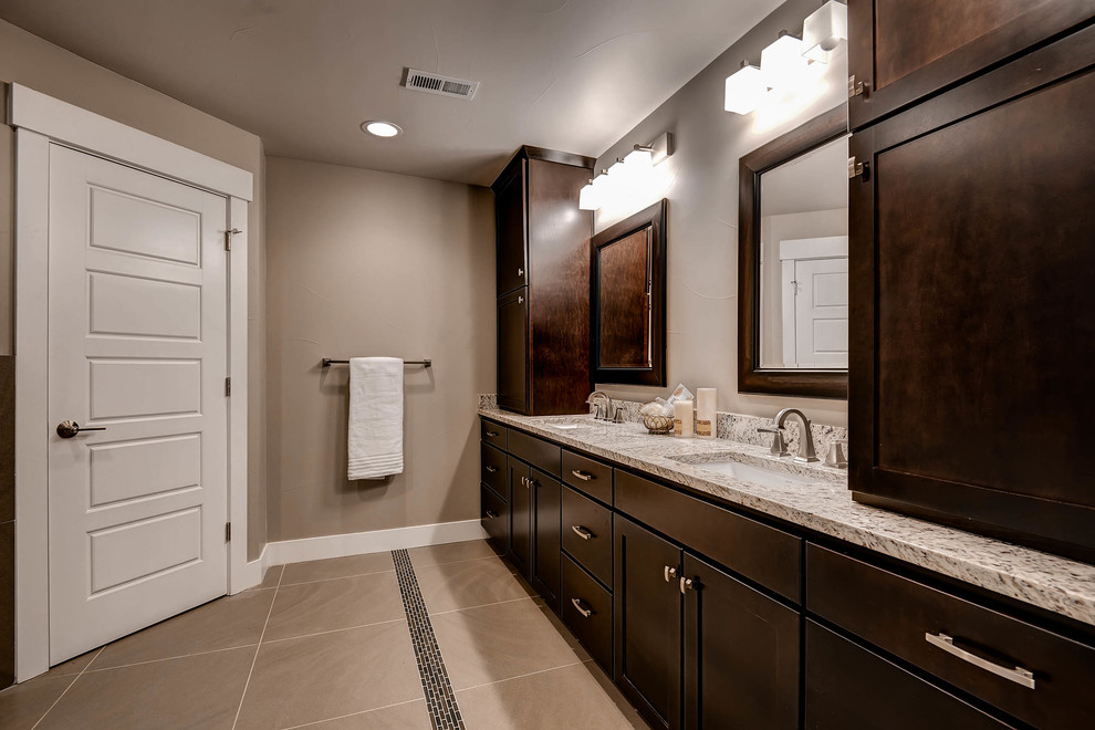 Inspiration for a large modern master bathroom in Denver with shaker cabinets, brown cabinets, a drop-in tub, an open shower, a two-piece toilet, multi-coloured tile, mirror tile, beige walls, ceramic floors, an undermount sink and granite benchtops.