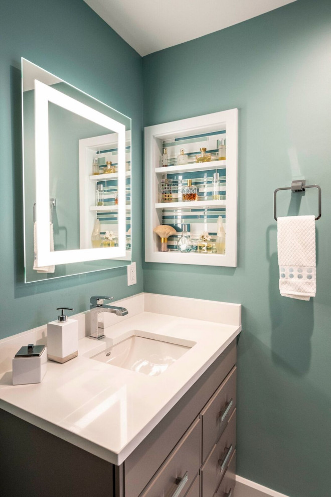Small transitional master ceramic tile, white floor and single-sink bathroom photo in Indianapolis with flat-panel cabinets, gray cabinets, a one-piece toilet, green walls, an undermount sink, quartz countertops, white countertops and a freestanding vanity