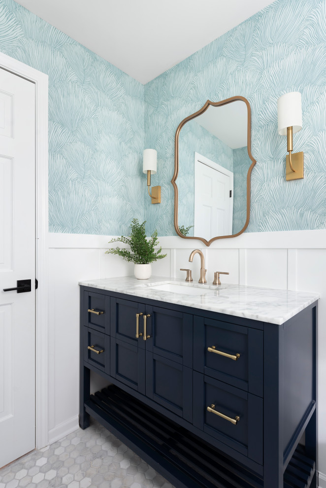Design ideas for a medium sized classic cloakroom in Chicago with shaker cabinets, blue cabinets, blue walls, marble flooring, a submerged sink, marble worktops, grey floors, white worktops, a freestanding vanity unit and wallpapered walls.