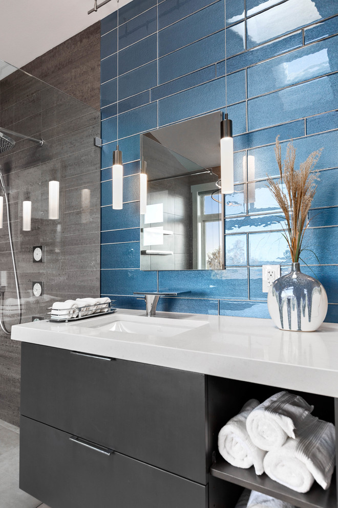 Design ideas for a large contemporary master bathroom in Seattle with flat-panel cabinets, black cabinets, a freestanding tub, a curbless shower, gray tile, porcelain tile, grey walls, porcelain floors, an undermount sink, engineered quartz benchtops, grey floor, an open shower and white benchtops.