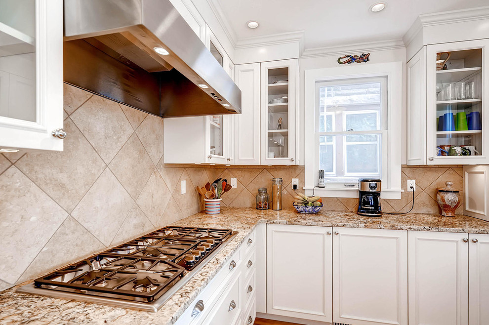 Example of a transitional kitchen design in Denver