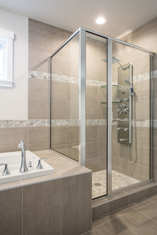 Inspiration for a mid-sized traditional bathroom in Seattle with shaker cabinets, dark wood cabinets, a drop-in tub, a corner shower, porcelain tile, porcelain floors, an undermount sink, engineered quartz benchtops, beige floor, a hinged shower door and white walls.