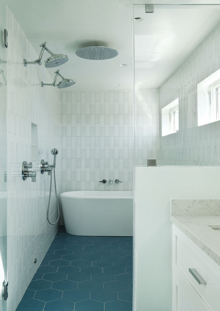 Freestanding bathtub - master white tile and ceramic tile ceramic tile, blue floor and double-sink freestanding bathtub idea in San Francisco with recessed-panel cabinets, white cabinets, an undermount sink, quartz countertops, a hinged shower door, gray countertops and a floating vanity