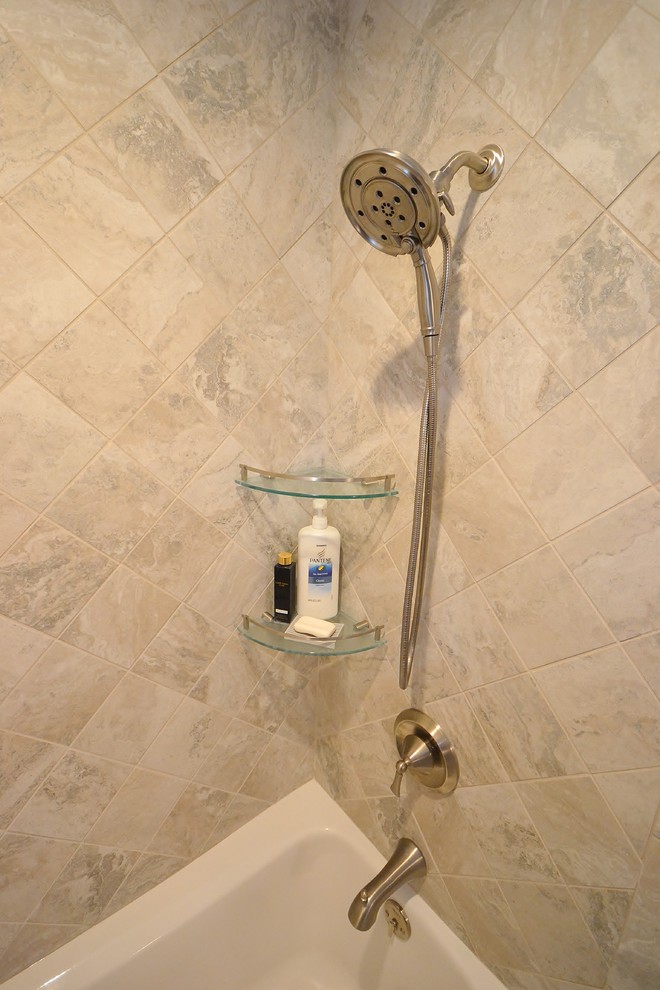 Inspiration for a large transitional 3/4 beige tile and ceramic tile ceramic tile home design remodel in Philadelphia with raised-panel cabinets, white cabinets, a one-piece toilet, beige walls, an undermount sink and granite countertops