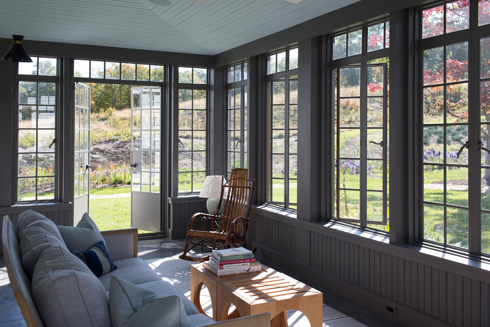 This is an example of a country sunroom in New York with a standard ceiling.