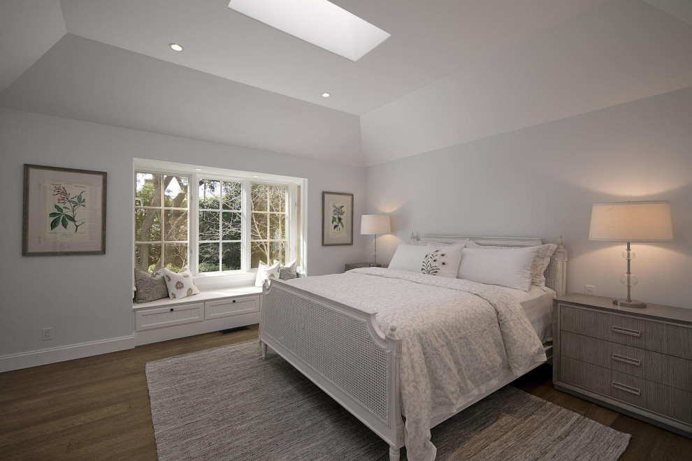 Inspiration for a traditional guest bedroom in Santa Barbara with grey walls, dark hardwood flooring, brown floors and a vaulted ceiling.