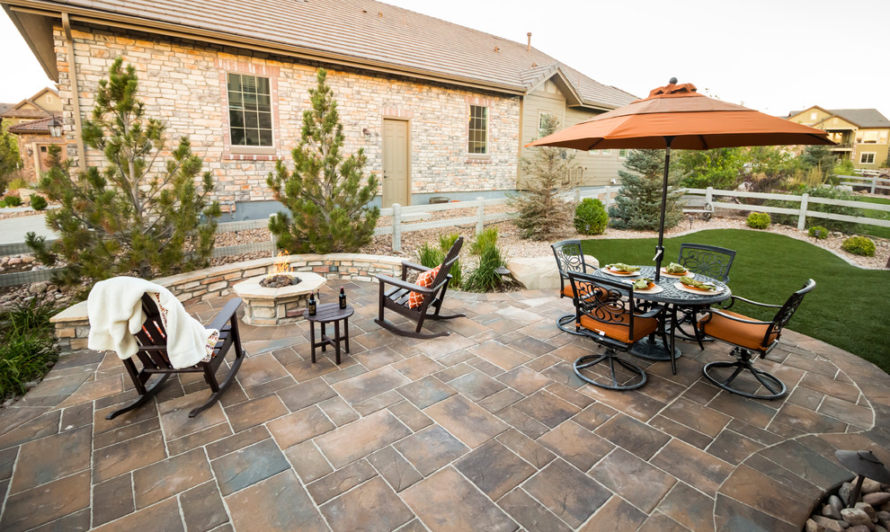 Design ideas for a country patio in Denver with a fire feature and brick pavers.