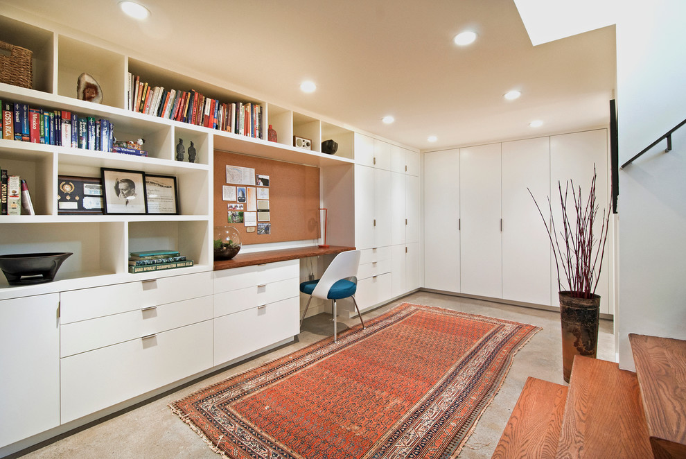 Small minimalist underground concrete floor and gray floor basement photo in Portland with white walls and no fireplace