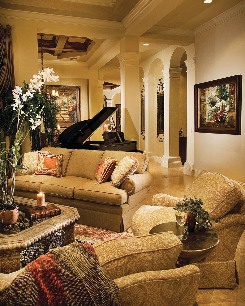 Inspiration for a large mediterranean formal enclosed living room in Miami with beige walls, travertine floors, a two-sided fireplace, a tile fireplace surround and no tv.