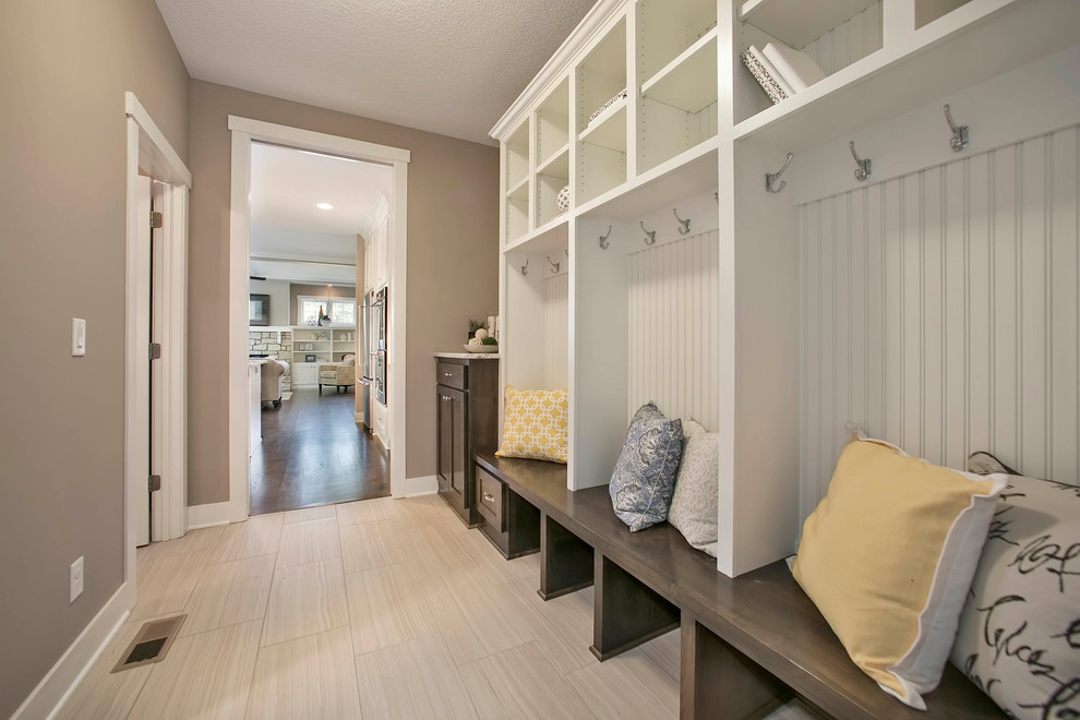 This is an example of a large mudroom in Minneapolis with beige walls.