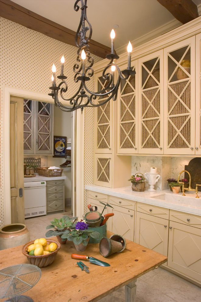 Photo of a traditional kitchen in Other with beige cabinets.
