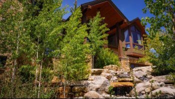 Example of a mountain style home design design in Orange County