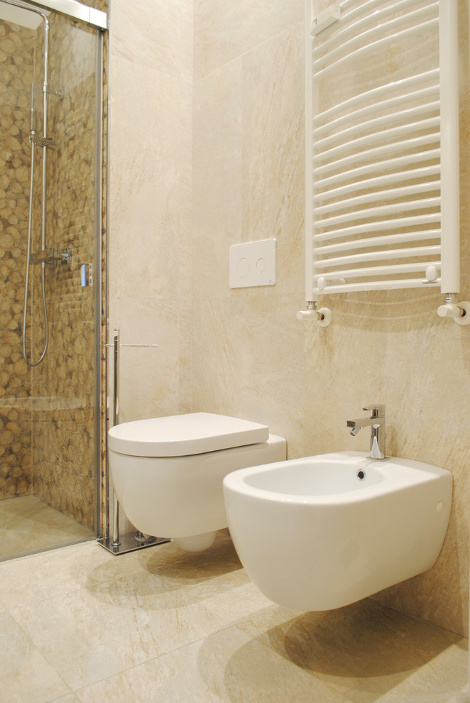 Photo of a modern 3/4 bathroom in Rome with brown cabinets, a curbless shower, a wall-mount toilet, beige tile, porcelain tile, beige walls, porcelain floors, a drop-in sink, beige floor and a sliding shower screen.