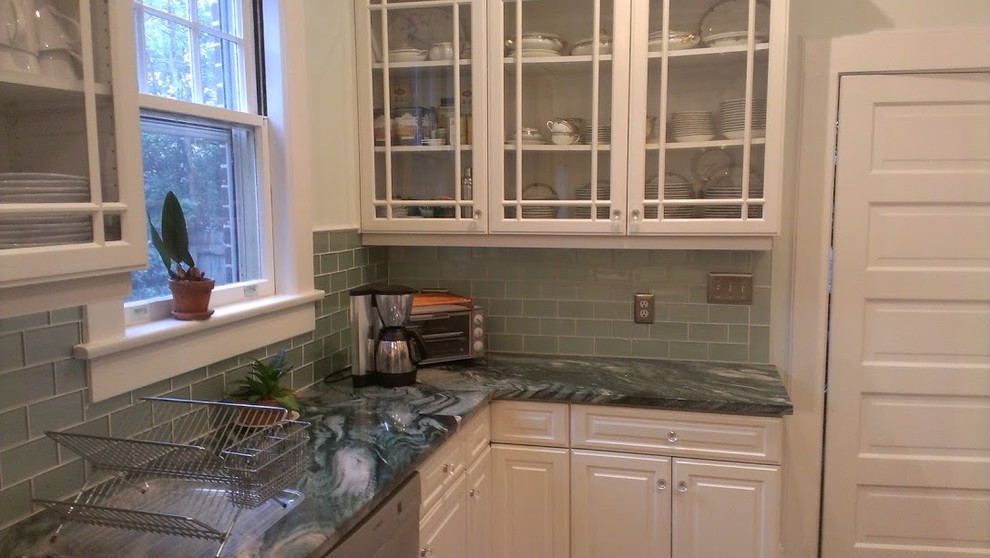 Inspiration for a mid-sized transitional kitchen pantry remodel with glass-front cabinets, white cabinets, granite countertops, blue backsplash, subway tile backsplash and blue countertops