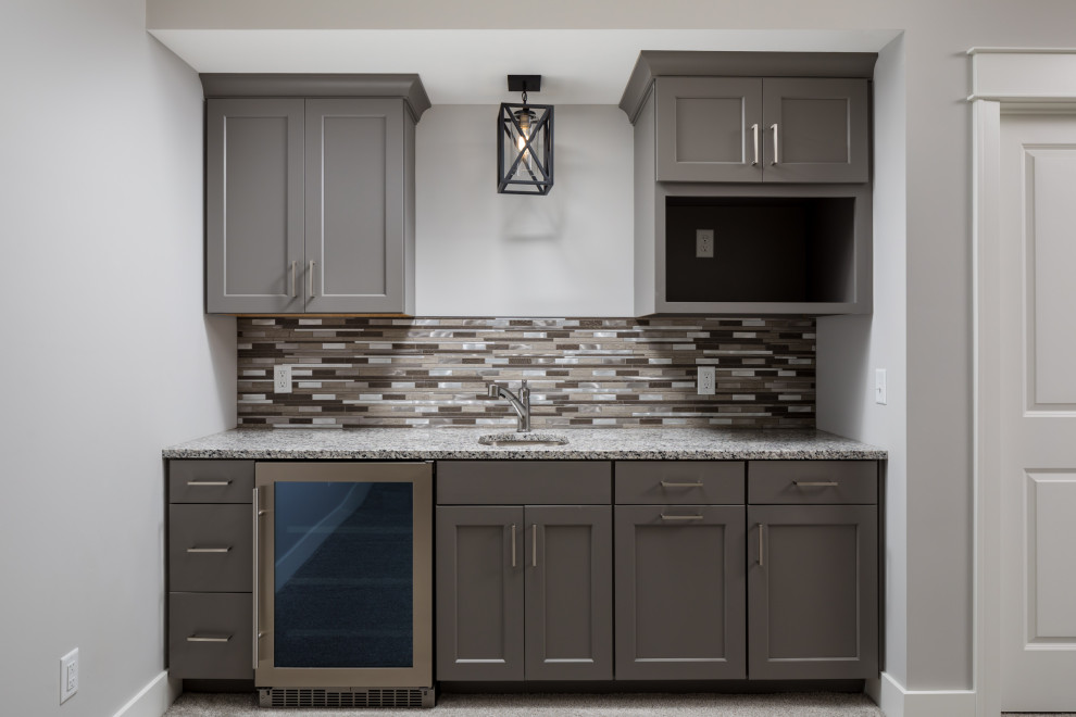 Design ideas for a small arts and crafts single-wall kitchen pantry in Grand Rapids with an undermount sink, recessed-panel cabinets, grey cabinets, quartz benchtops, multi-coloured splashback, ceramic splashback, stainless steel appliances, carpet, no island, grey floor and multi-coloured benchtop.