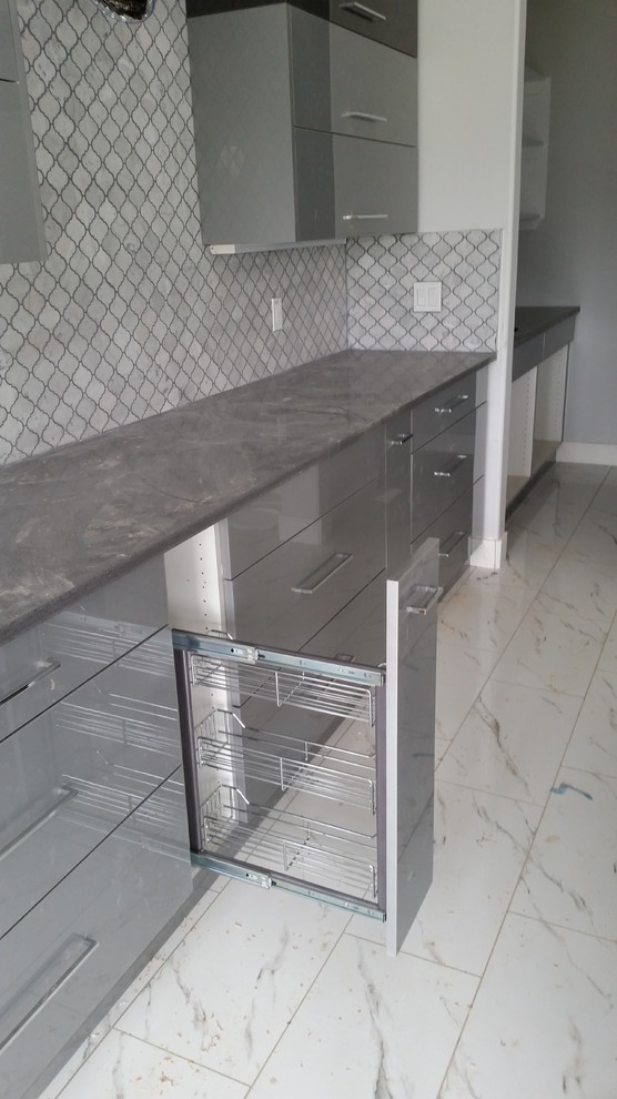 Inspiration for a mid-sized contemporary kitchen in Edmonton with flat-panel cabinets, grey cabinets, concrete benchtops, grey splashback, mosaic tile splashback and marble floors.