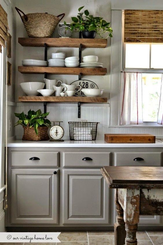 This is an example of a small kitchen in New York with raised-panel cabinets, grey cabinets, white splashback, ceramic floors and with island.