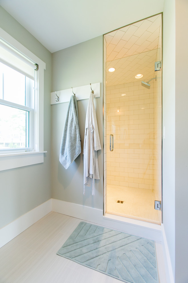 This is an example of a mid-sized country master bathroom in Other with recessed-panel cabinets, white cabinets, a double shower, a one-piece toilet, gray tile, subway tile, grey walls, ceramic floors, an undermount sink and engineered quartz benchtops.