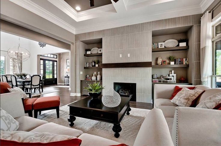 Inspiration for a mid-sized modern open concept family room in Other with beige walls, dark hardwood floors, a standard fireplace and a tile fireplace surround.