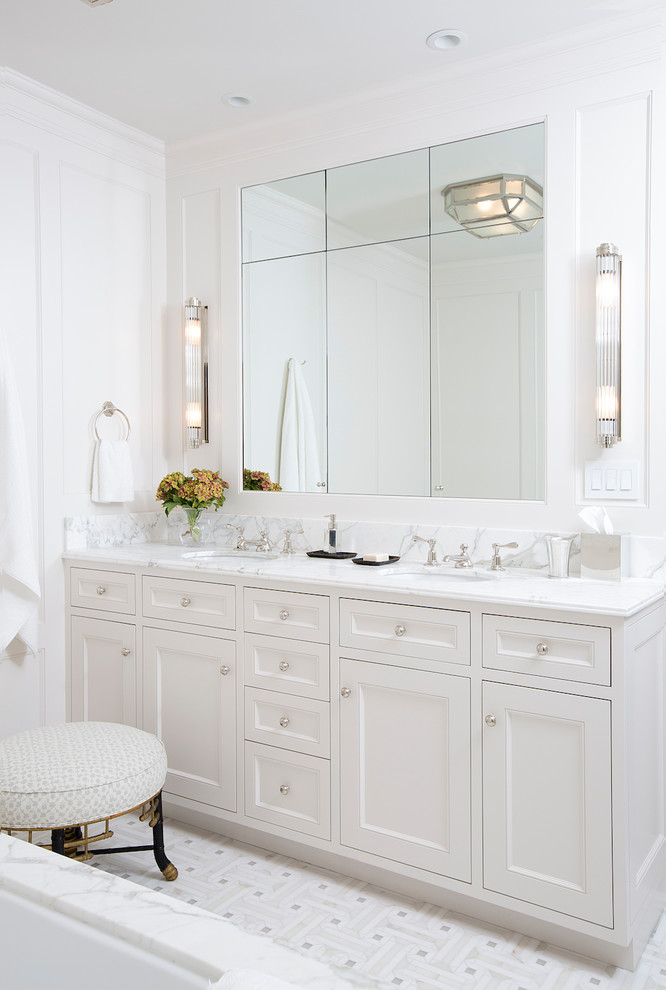 Transitional master bathroom in San Francisco with beaded inset cabinets, white cabinets, an undermount tub, an alcove shower, a one-piece toilet, white walls, marble floors, an undermount sink, marble benchtops, white floor, a hinged shower door and white benchtops.