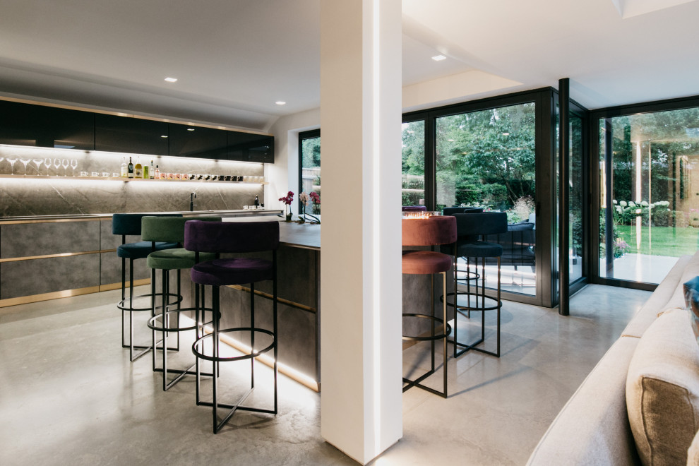 Design ideas for a mid-sized contemporary home bar in Dorset with concrete floors.