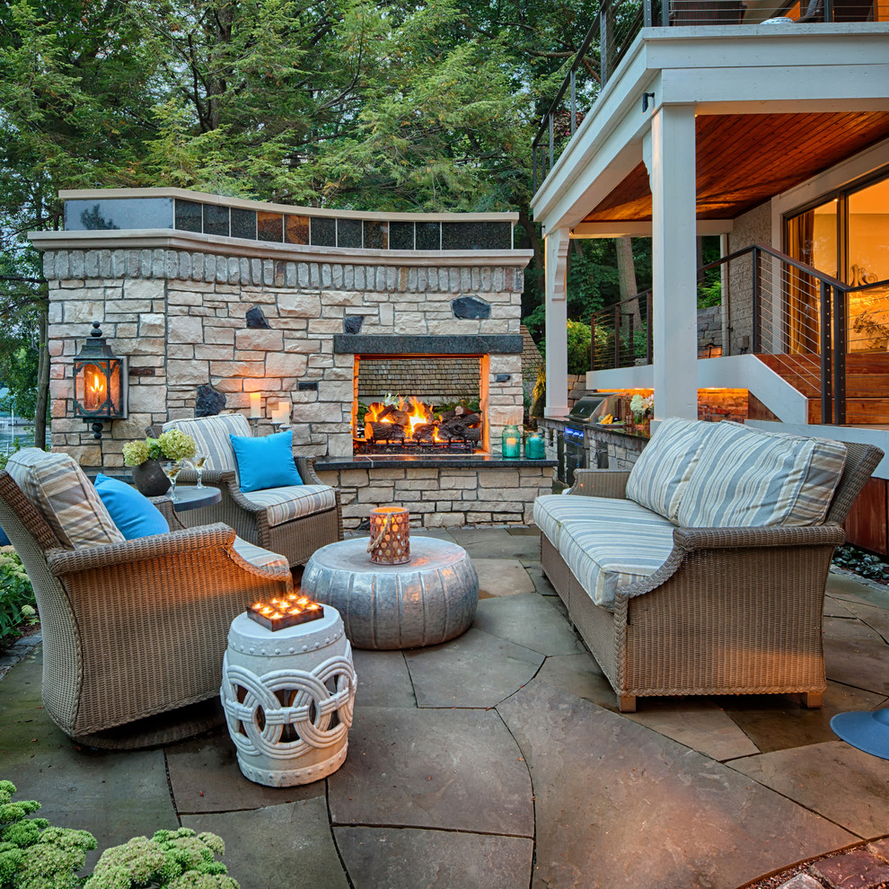 Photo of a contemporary patio in Minneapolis with no cover and with fireplace.