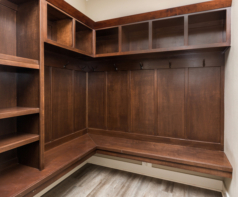 Mudroom - transitional vinyl floor mudroom idea with beige walls and a white front door