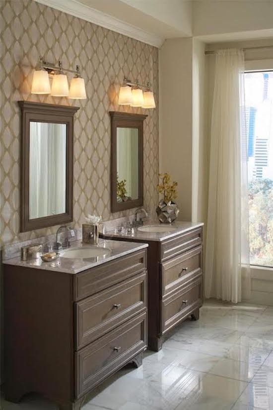 This is an example of a mid-sized traditional master bathroom in San Diego with recessed-panel cabinets, dark wood cabinets, brown walls, marble floors, an undermount sink, granite benchtops and white floor.