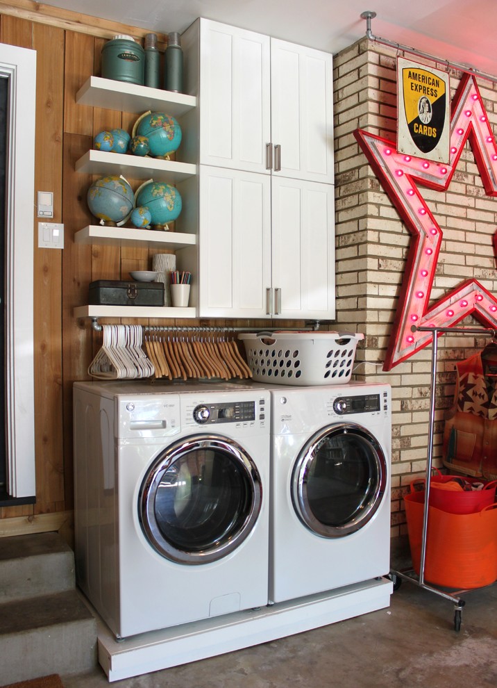 Eclectic laundry room in Dallas with a side-by-side washer and dryer.