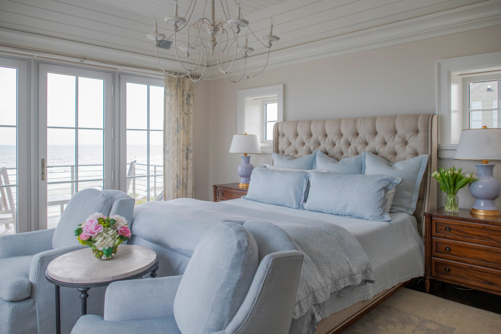 Inspiration for a beach style master bedroom in Charleston with timber.