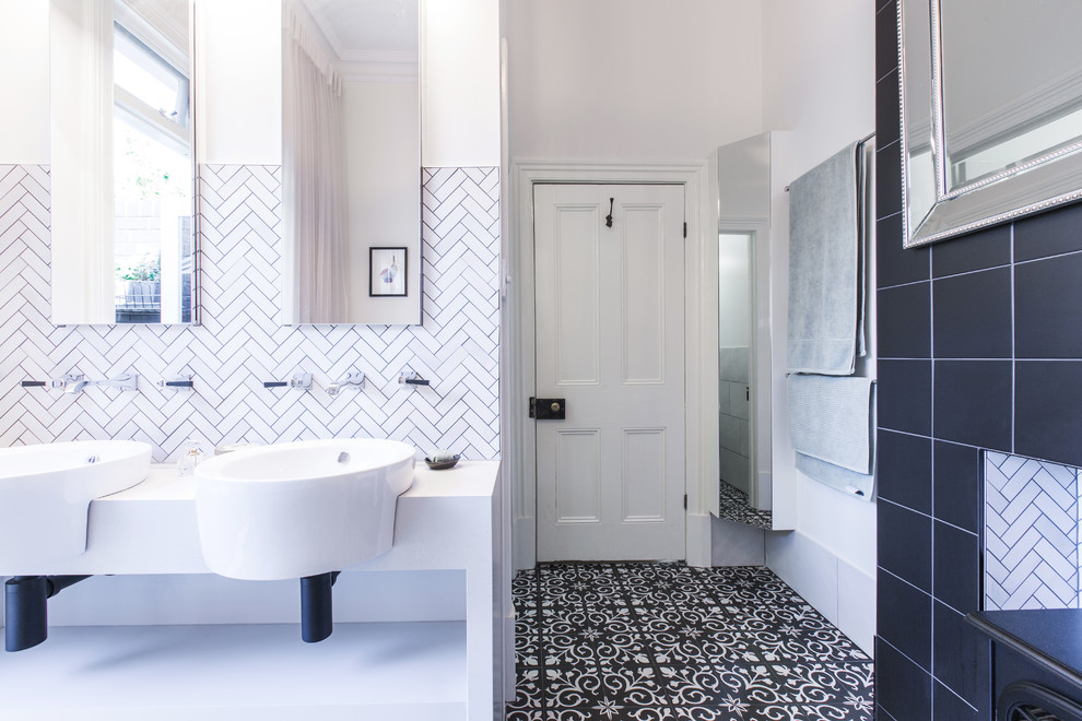 Photo of a large traditional master bathroom in Adelaide with open cabinets, ceramic tile, white walls, porcelain floors, solid surface benchtops, black floor and white benchtops.